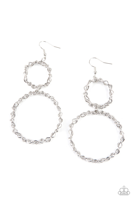 Paparazzi Accessories Twist of FABULOUS - Silver Strands of shiny and textured silver metal wires are twisted and braided together to form two rugged glittery rings. The larger ring connects to the bottom of the smaller ring, creating a striking lure with