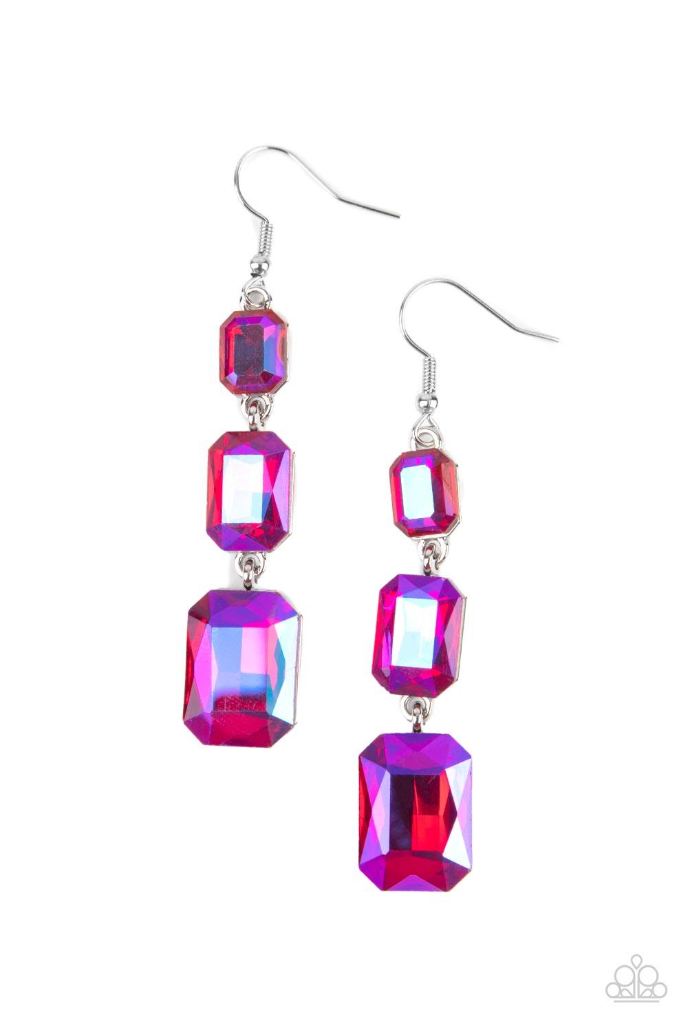 Paparazzi Accessories Cosmic Red Carpet - Pink Featuring a dazzling pink UV shimmer, a trio of emerald-cut gems in graduating sizes is linked one below the other for a dramatic red carpet finish. Earring attaches to a standard fishhook fitting. Sold as on