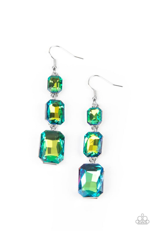 Paparazzi Accessories Cosmic Red Carpet - Green Featuring a dazzling green and gold UV shimmer, a trio of emerald-cut gems in graduating sizes is linked one below the other for a dramatic red carpet finish. Earring attaches to a standard fishhook fitting.