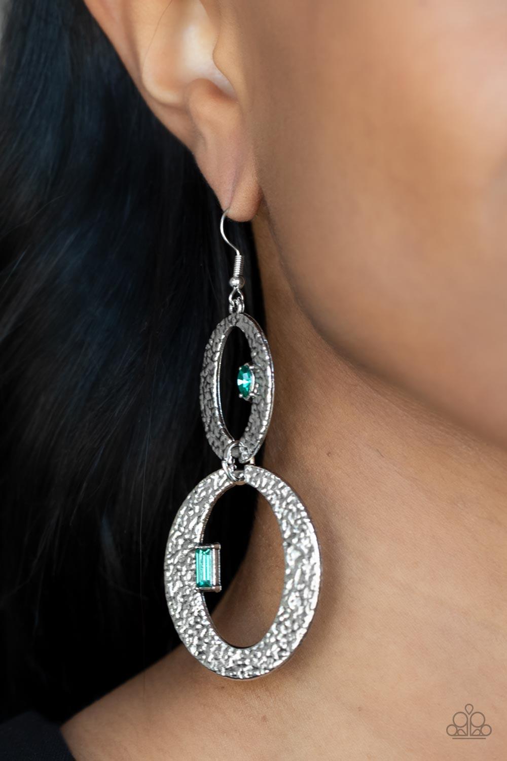 Paparazzi Accessories OVAL and OVAL Again - Green Infused with edgy marquise and emerald cut green rhinestones, hammered flat silver ovals delicately link into a gritty glamorous lure. Earring attaches to a standard fishhook fitting. Sold as one pair of e
