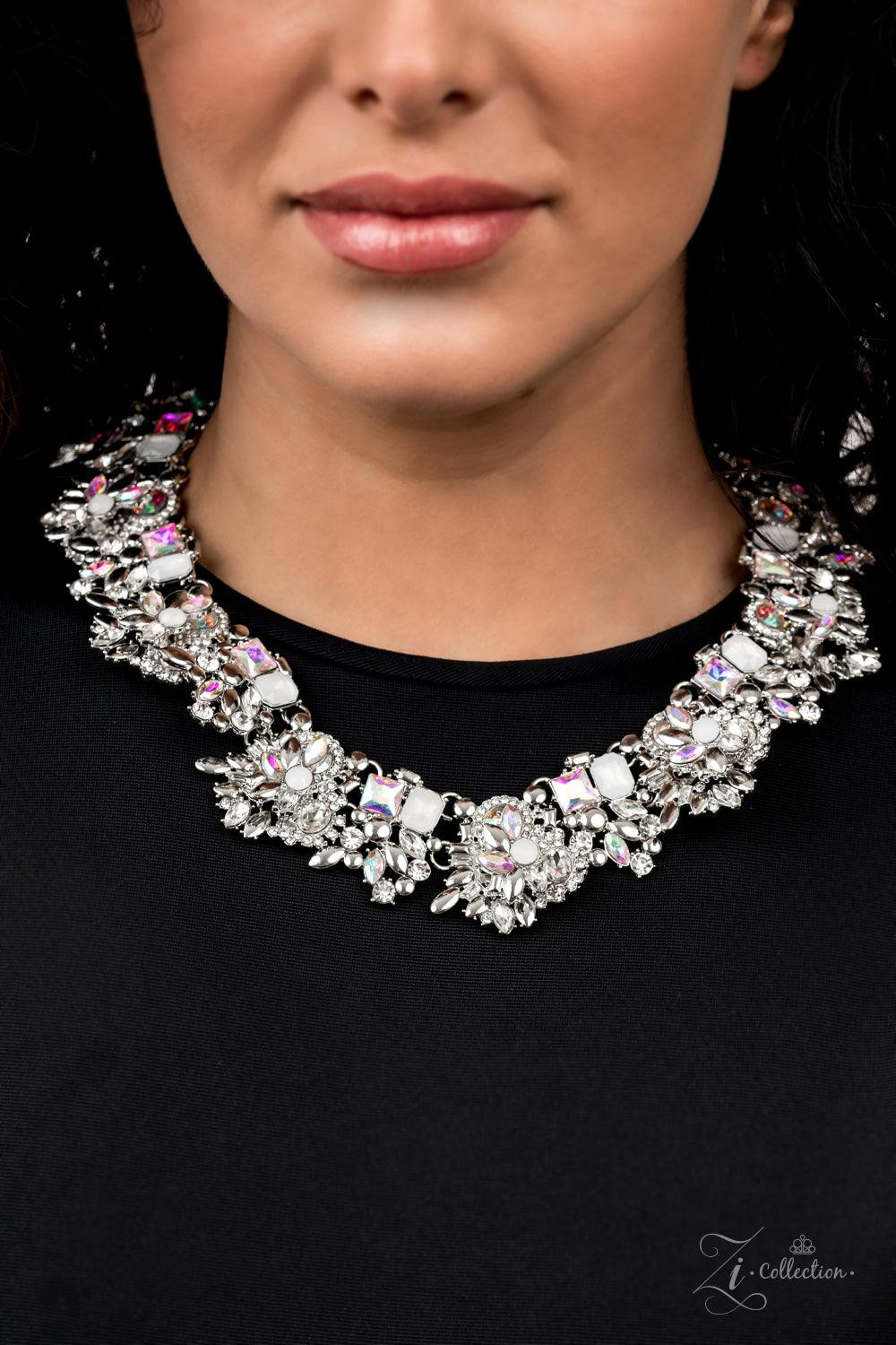Paparazzi Accessories Exceptional An irresistible collection of iridescent, classic white, and milky white rhinestones intentionally coalesces and stacks into opulent silver accented frames. Varying in size and cuts, the mismatched rhinestone spangled fra