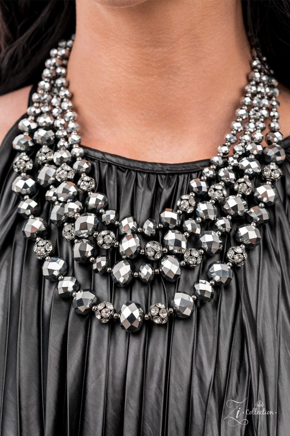 Paparazzi Accessories Influential Gradually increasing in size and intensity, dainty gunmetal beads, faceted hematite-like crystals, and white rhinestone studded gunmetal ornaments unapologetically connect into dauntless rows below the collar. The radiant