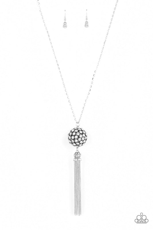 Paparazzi Accessories Rhinestone Revolution - White Infused with silver studded fittings, a glittery collection of sparkly white rhinestones coalesce into a dramatic pendant at the bottom of a lengthened silver chain. Capped in a rhinestone dotted frame,