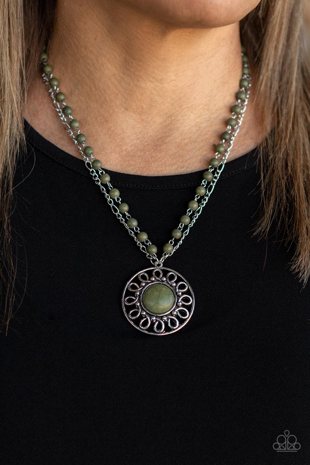 Paparazzi Accessories Sahara Suburb - Green A dainty silver chain is paired with a grounding green stone beaded chain below the collar. An oversized green stone adorns the center of an antiqued silver frame radiating with silver studded and wire-like deta