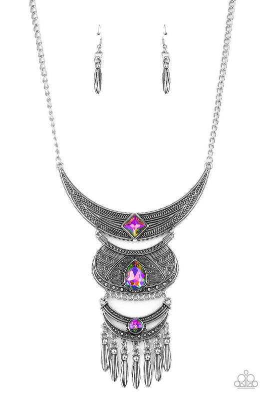 Paparazzi Accessories Lunar Enchantment - Multi Embossed in studded, geometric, and paisley filigree-like patterns, three mismatched silver half moon plates dramatically link below the collar. Featuring an iridescent UV shimmer, an oversized collection of