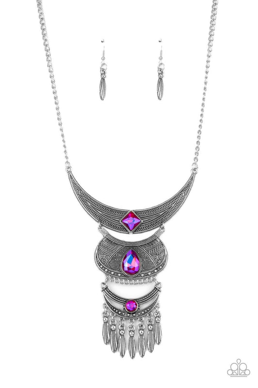 Paparazzi Accessories Lunar Enchantment - Pink Embossed in studded, geometric, and paisley filigree-like patterns, three mismatched silver half moon plates dramatically link below the collar. Featuring an entrancing pink UV shimmer, an oversized collectio