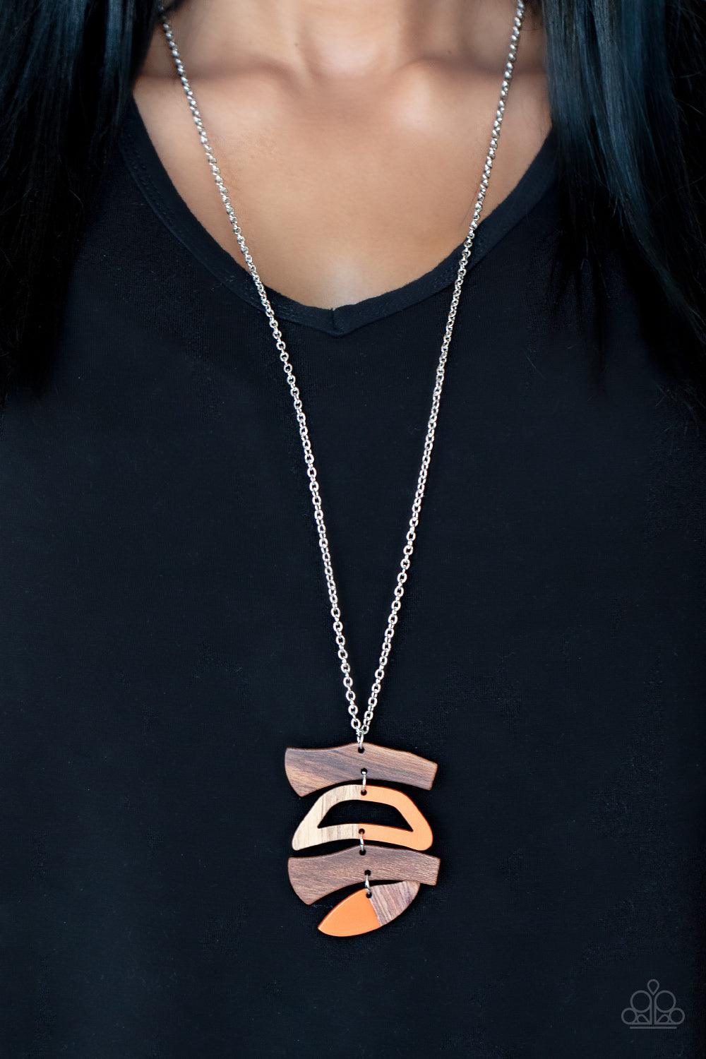 Paparazzi Accessories A WOODWORK In Progress - Orange Featuring orange acrylic accents, mismatched wooden frames delicately link into an abstract pendant at the bottom of a lengthened silver chain for an earthy fashion. Features an adjustable clasp closur