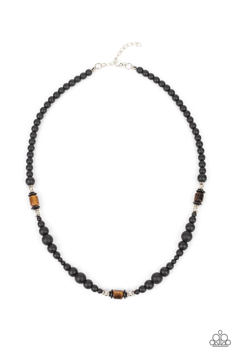 Paparazzi Accessories Stone Synchrony - Brown Grounding sections of dainty silver beads and Tiger's eye stone accents adorn a strand of black stone beads, creating an earthy compliment below the collar. Features an adjustable clasp closure. Sold as one in