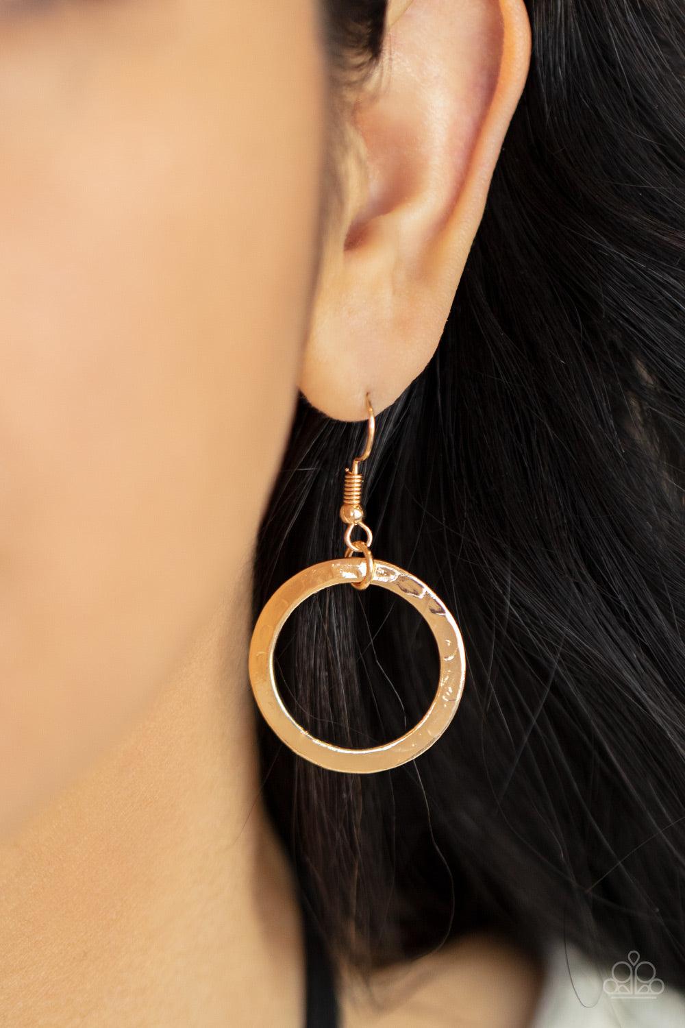 Paparazzi Accessories Spiraling Out of COUTURE - Gold Black suede cords knot around a mismatched assortment of hammered gold rings that interlock below the collar, creating two rows of dizzying texture. Features an adjustable clasp closure. Sold as one in