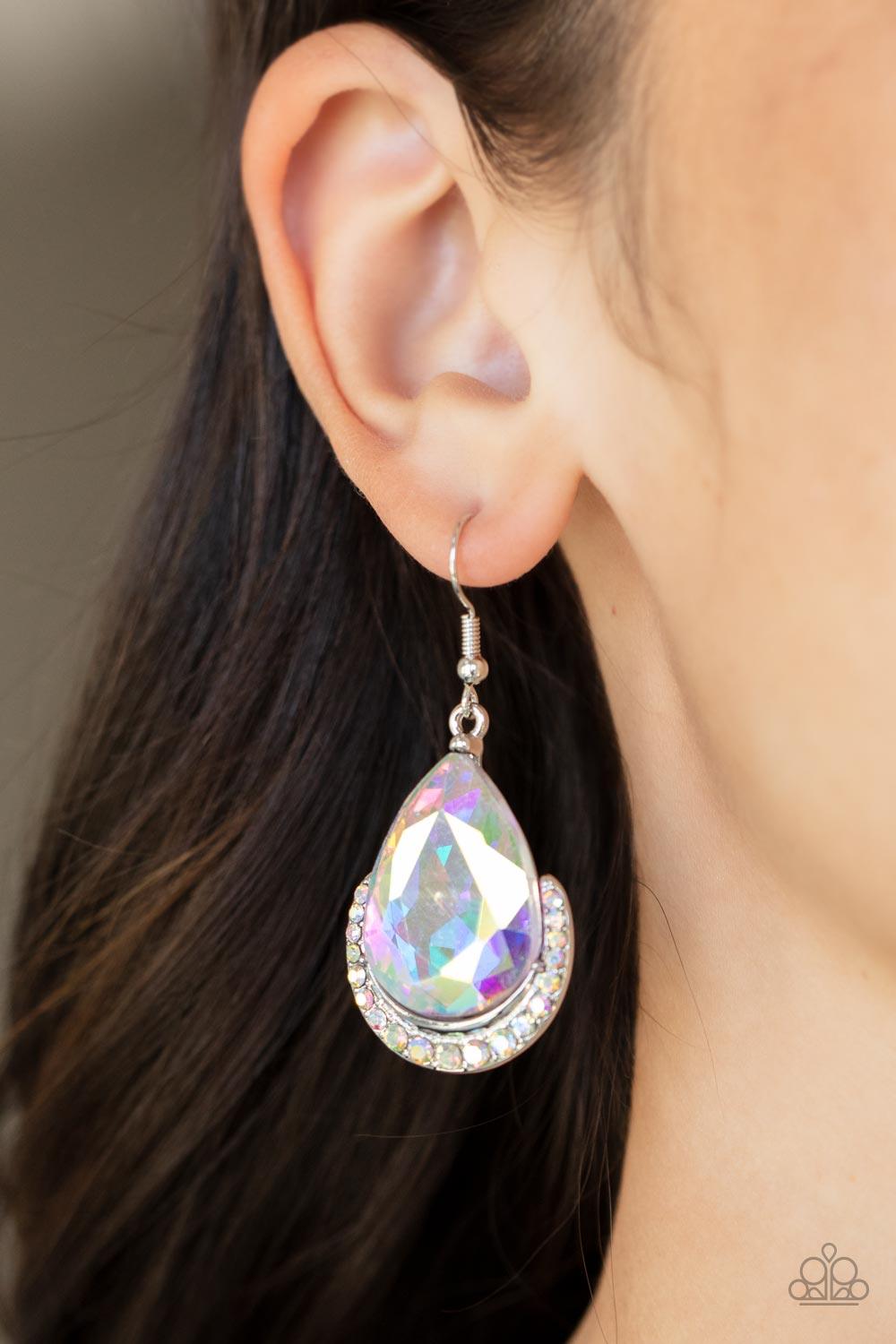 Paparazzi Accessories Mega Marvelous - Multi Dotted in iridescent rhinestones, a dainty silver bar curves around the bottom of a dramatically oversized teardrop rhinestone for a glamorous fashion. Earring attaches to a standard fishhook fitting. Sold as o