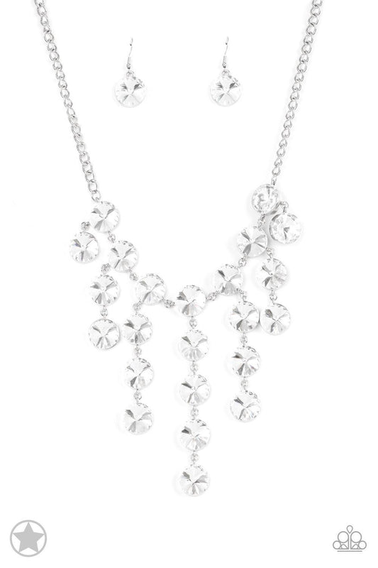 Paparazzi Accessories Spotlight Stunner - White Encased in sleek silver fittings, dramatically oversized white rhinestones delicately link into twinkly tassels that taper off into a jaw-dropping fringe below the collar. Features an adjustable clasp closur