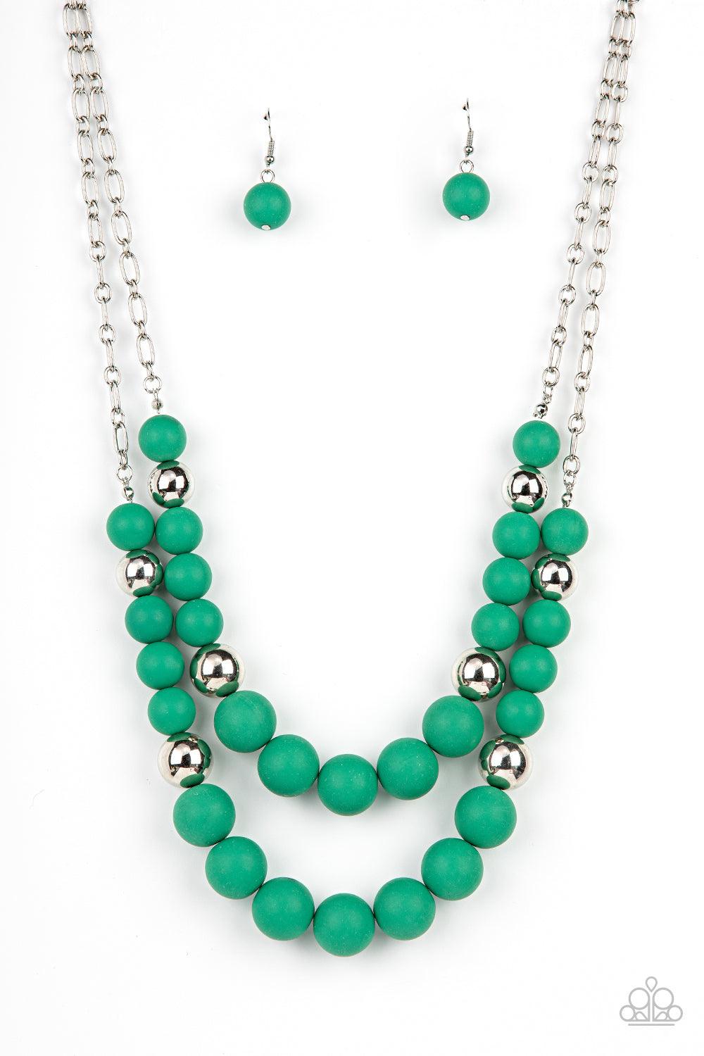 Paparazzi Accessories Vivid Vanity - Green Gradually increasing in size, two oversized rows of silver and Leprechaun beads layer into two bubbly layers below the collar. Features an adjustable clasp closure. Sold as one individual necklace. Includes one p