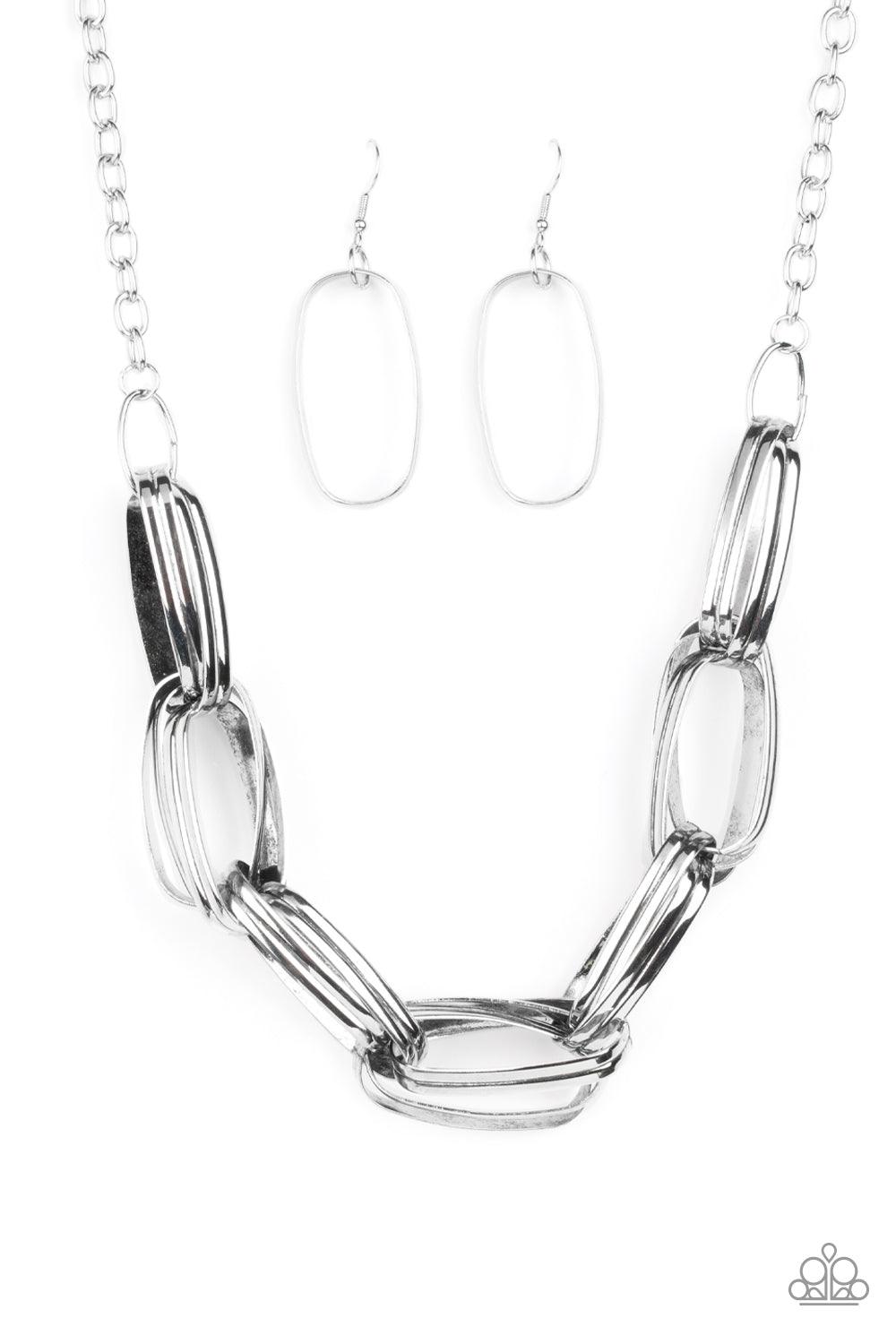 Paparazzi Accessories Fiercely Flexing - Silver Brushed in an antiqued shimmer, pairs of oversized oval silver links dramatically connect into a gritty chain below the collar for a bold industrial look. Features an adjustable clasp closure. Sold as one in