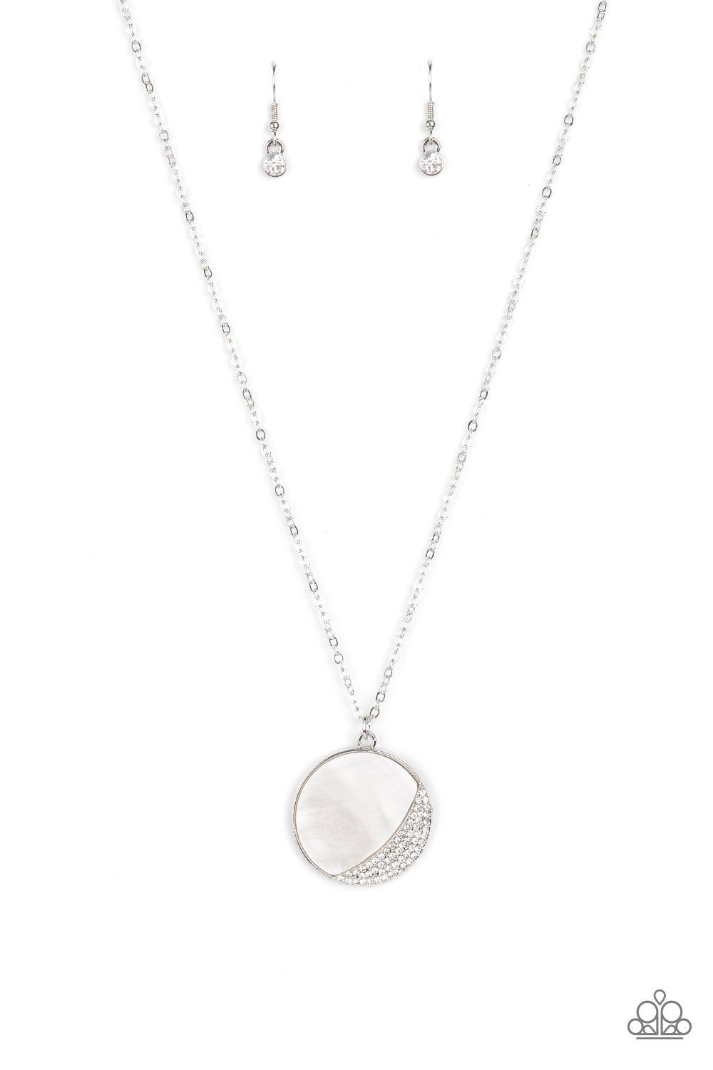 Paparazzi Accessories Oceanic Eclipse - White A white shell-like pendant is eclipsed in a half moon silver frame that is encrusted in sparkly white rhinestones, creating a shimmery display below the collar. Features an adjustable clasp closure. Sold as on