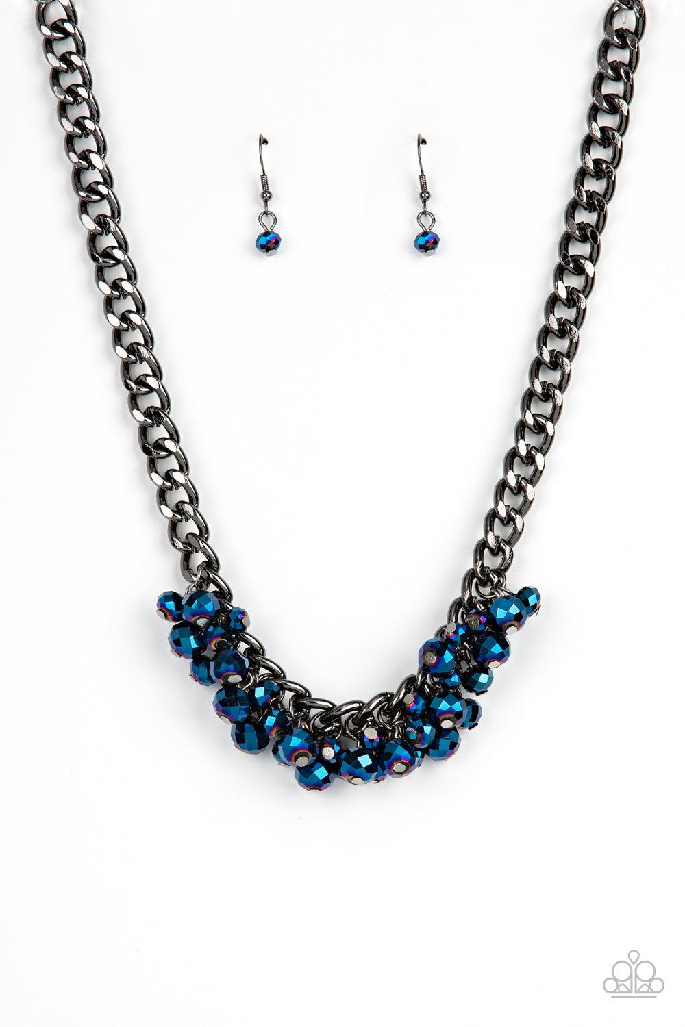 Paparazzi Accessories Galactic Knockout - Blue A faceted collection of metallic flecked blue beads cluster along the center of a chunky gunmetal curb chain, creating a stellar fringe below the collar. Features an adjustable clasp closure. Sold as one indi