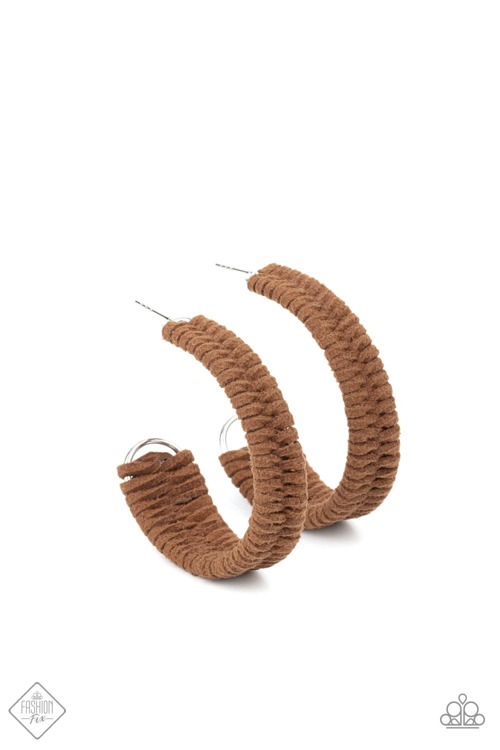 Paparazzi Accessories Rural Guru - Brown Brown suede cording crisscrosses around a layered silver frame that widens as it curves into a simple hoop, creating a textured handcrafted design. Hoop measures approximately 2" in diameter. Earring attaches to a