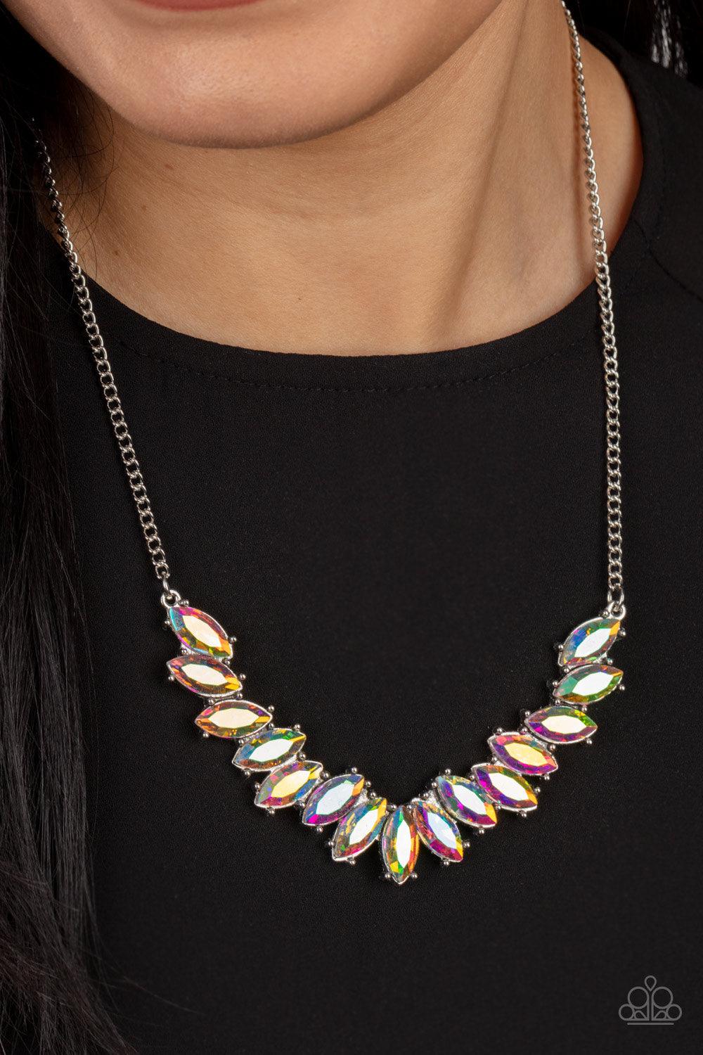 Paparazzi Accessories Galaxy Game-Changer - Multi Featuring pronged silver fittings, a sparkly series of iridescent marquise cut rhinestones fan out below the collar for a stellar statement-making look. Features an adjustable clasp closure. Sold as one in