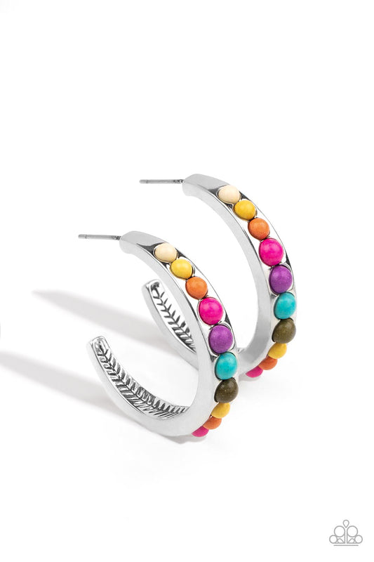 Paparazzi Accessories Rural Relaxation - Multi The front of a dainty silver hoop is dotted in a row of multicolored stone beads, creating a colorfully rustic look. Earring attaches to a standard post fitting. Hoop measures approximately 1" in diameter. So