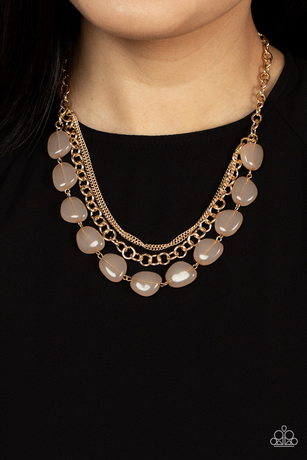 Paparazzi Accessories Pumped Up Posh - Gold Layers of dainty and classic gold chain mingle with a row of flattened asymmetrical champagne-colored beads for a polished and posh layered look below the collar. Features an adjustable clasp closure. Sold as on