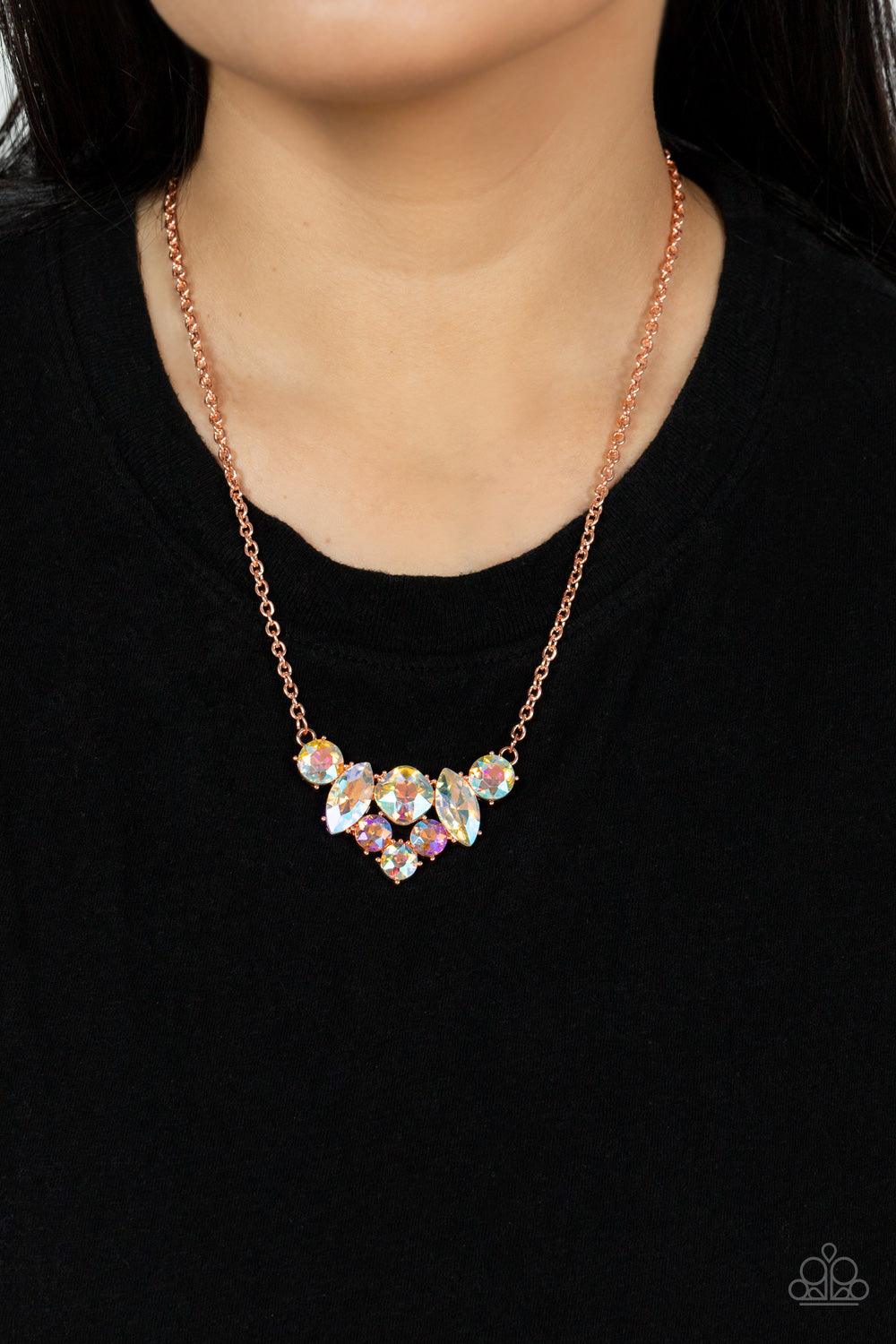 Paparazzi Accessories Lavishly Loaded - Copper A glittering collection of marquise and round peach-colored gems encased in studded copper fittings, coalesce into a lavish frame that gives way to a classic shiny copper chain resulting in a glamorous finish