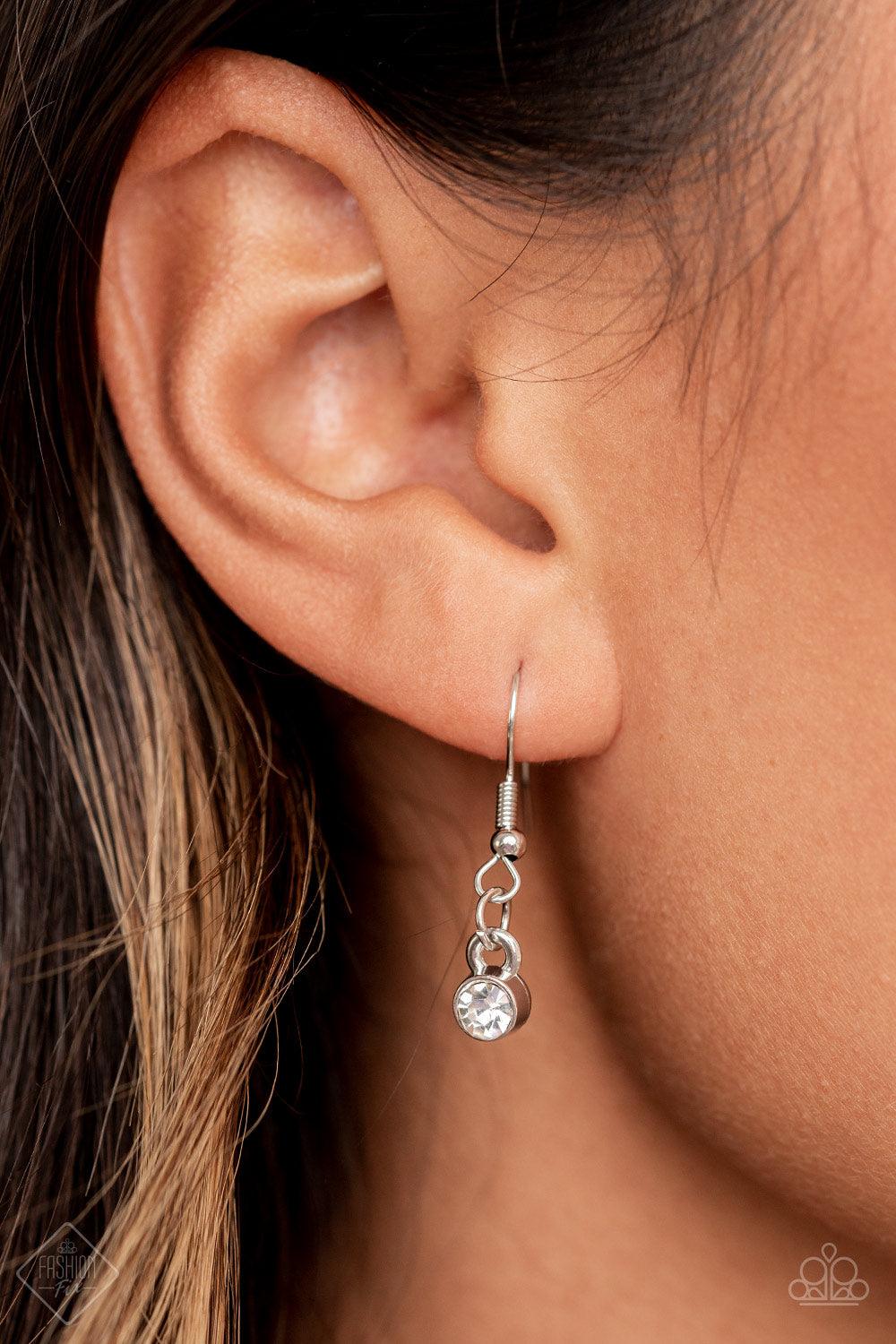 Paparazzi Accessories Won The Lottery - White Layers of brilliant white rhinestones in graduating sizes are encased in simple silver frames as they fall from a classic silver chain and delicately link across the collar, creating a dramatic display of swoo