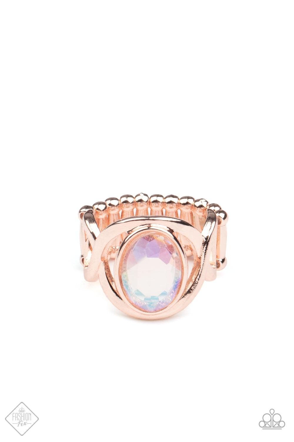 Paparazzi Accessories Mystical Treasure - Rose Gold Interwoven rose gold bars delicately encircle an iridescent Pale Rosette gem, creating a mystical centerpiece atop the finger. Features a stretchy band for a flexible fit. Sold as one individual ring. Ri
