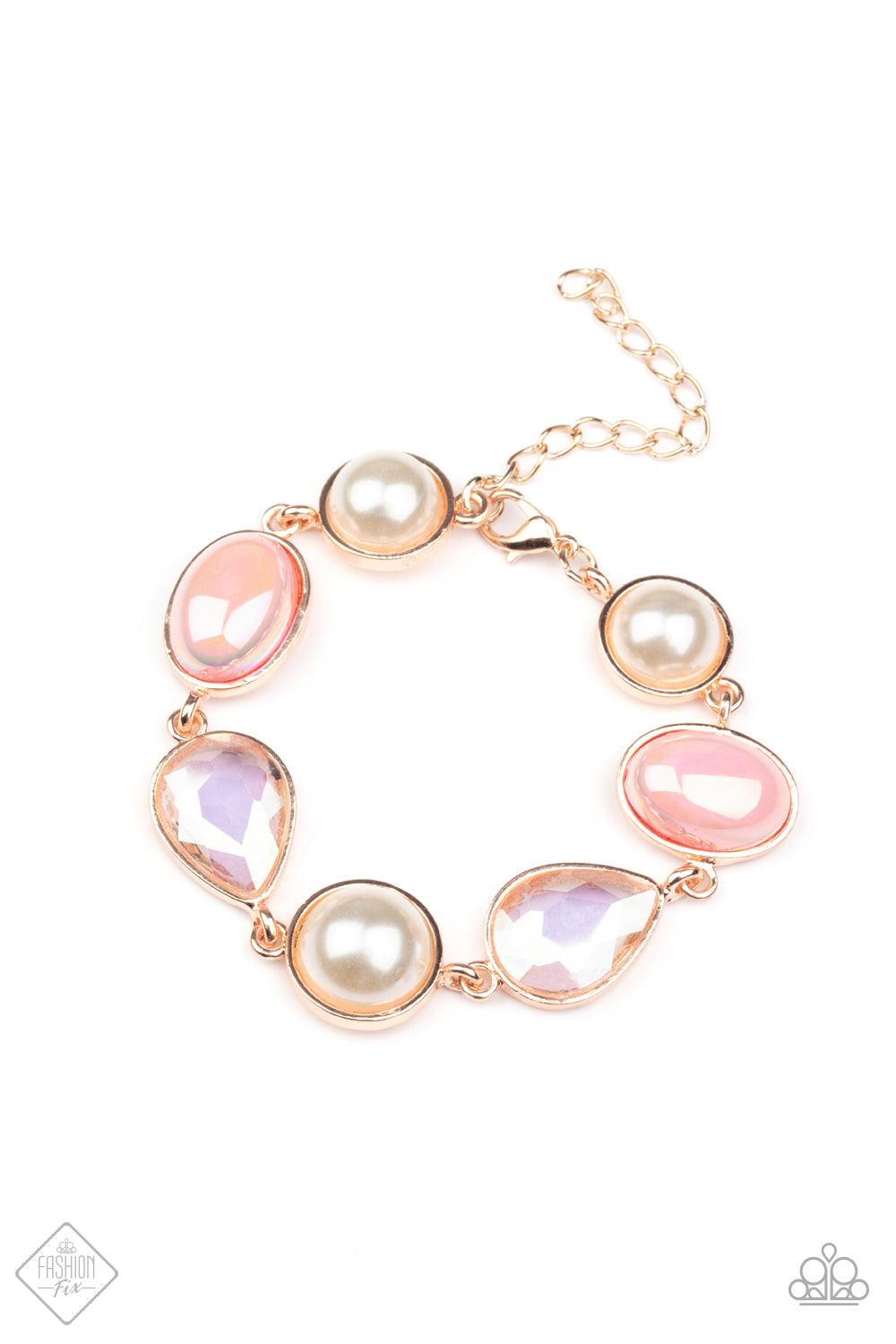 Paparazzi Accessories Nostalgically Nautical - Rose Gold A collection of classic white pearls, Pale Rosette pearls glazed in a reflective finish, and iridescent teardrops wrap around the wrist in an ethereal display. Rose gold frames encase each bead, add