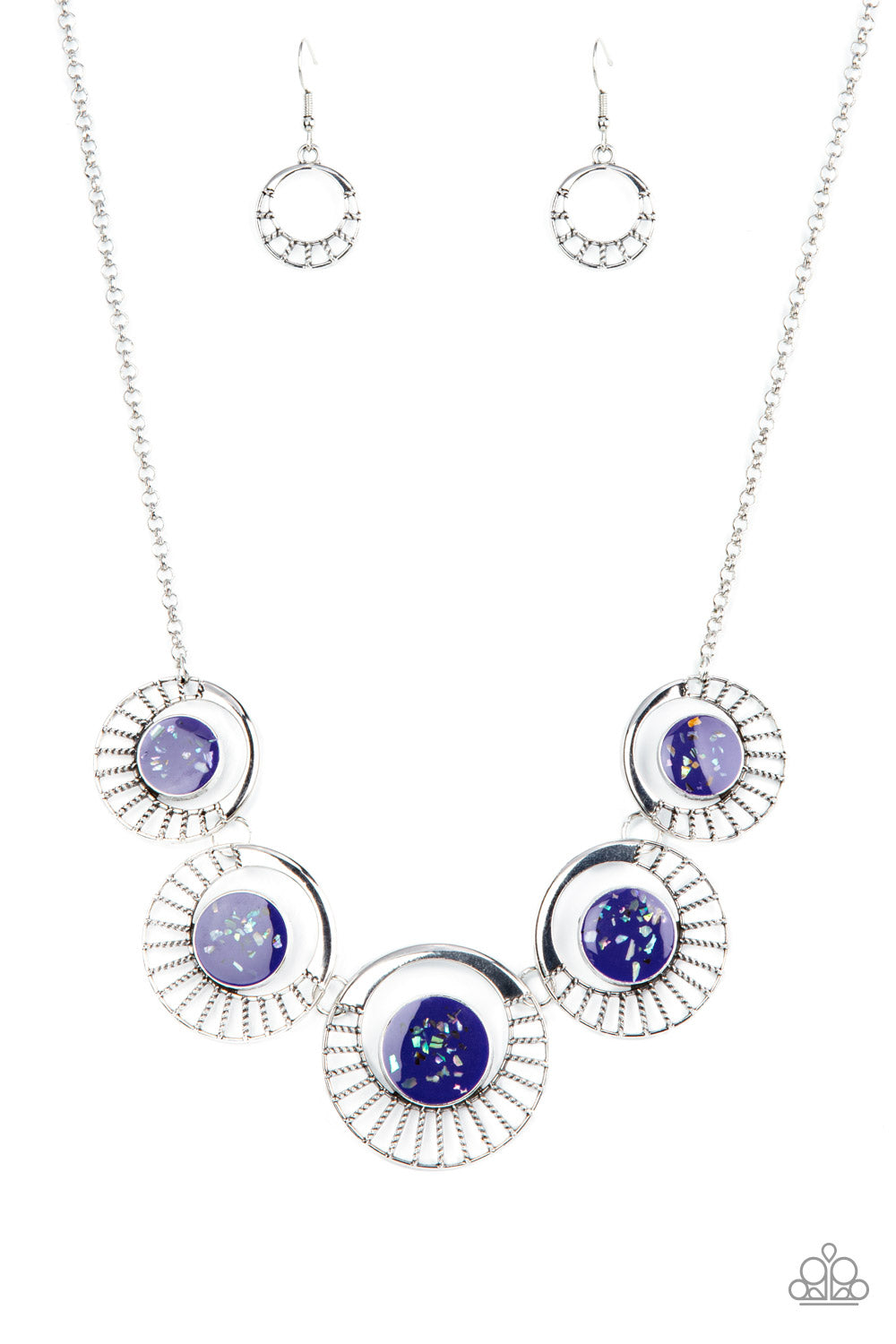 Paparazzi Accessories Elliptical Effervescence - Purple Flecked with shell-like accents, shiny purple frames adorn the centers of circulating silver frames below the collar. Featuring studded silver spokes that flair out from the bottom, the colorful fram