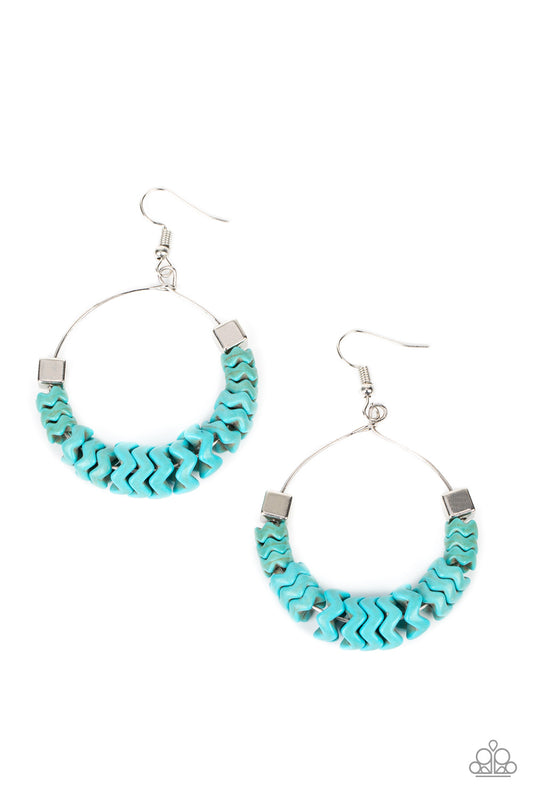 Paparazzi Accessories Capriciously Crimped - Blue Featuring a faux stone finish, crimped turquoise discs glide along a dainty wire hoop. A pair of cube beads join the earthy compilation, adding an edgy hint of shimmer. Earring attaches to a standard fishh