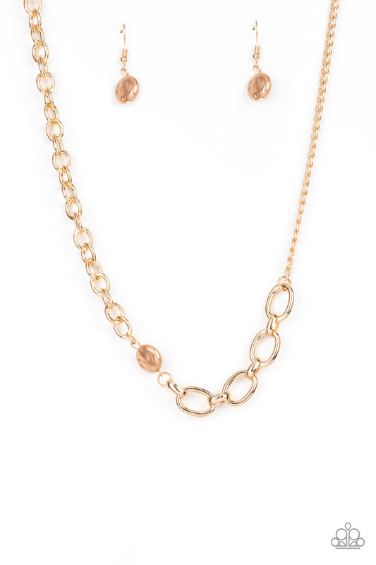Paparazzi Accessories Picnic in Paris - Brown A hammered pearly brown bead sits asymmetrically between two mismatched oversized gold chains, adding an industrial twist to the timeless look. Features an adjustable clasp closure. Sold as one individual neck