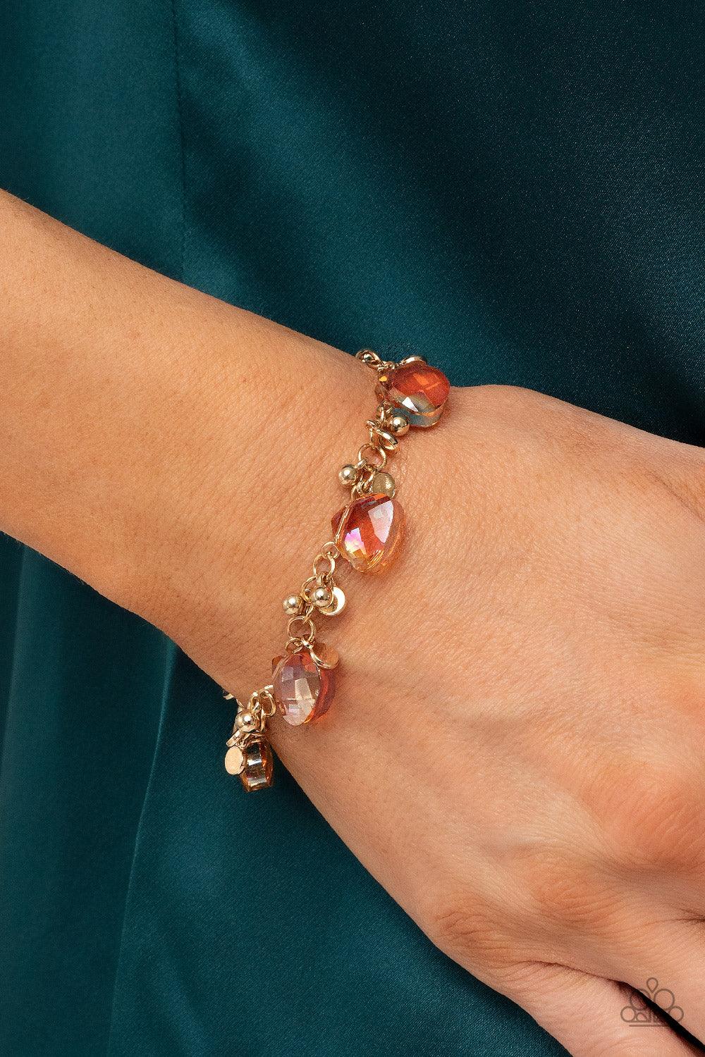 Paparazzi Accessories Super Nova Nouveau - Gold Dainty clusters of gold beads and gold discs connect with Iridescent gold gems around the wrist, resulting in a stellar fringe. Features an adjustable clasp closure. Sold as one individual bracelet. Get The