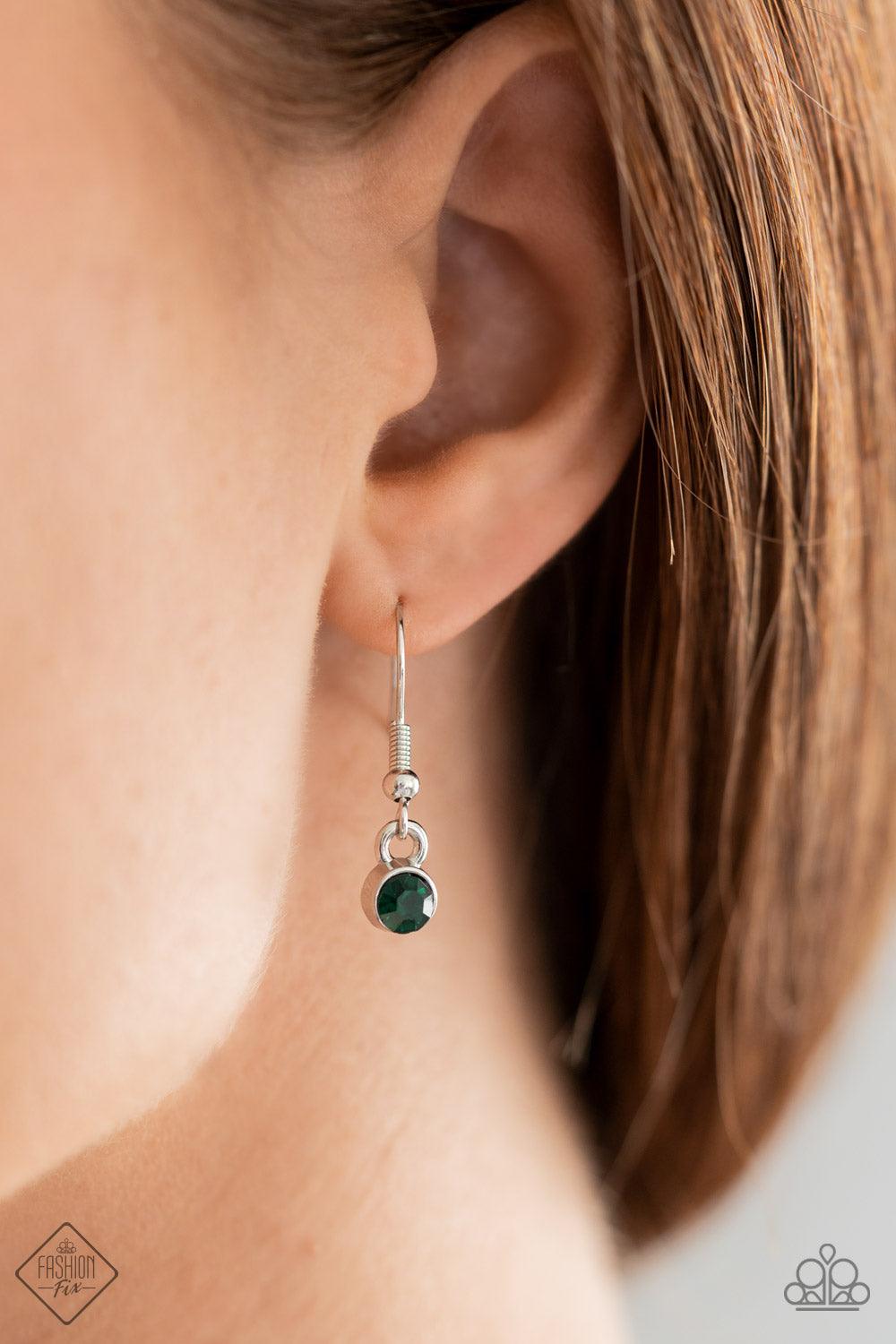 Paparazzi Accessories Royally Romantic - Green Exquisite heart motifs dotted with dainty emerald rhinestones coalesce into airy medallions that link to a modest silver chain. The varying sizes and permeating patterns of the medallions create a romanticall