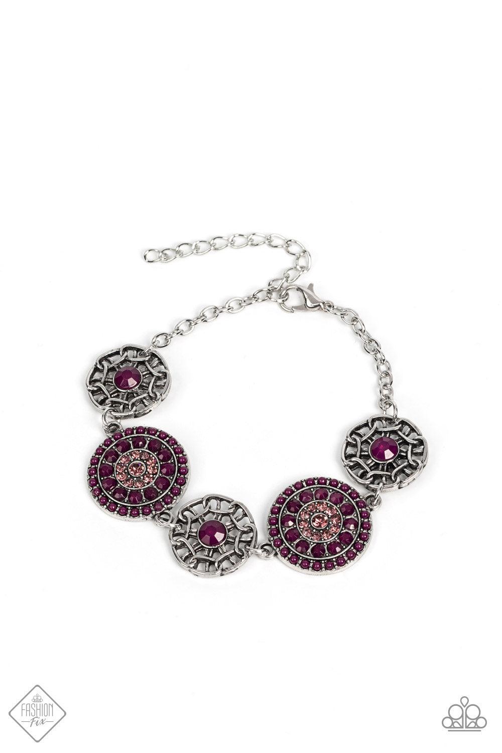 Paparazzi Accessories Vogue Garden-Variety - Purple Bursts of faceted plum beads and sparkling light amethyst rhinestones radiate from the centers of antiqued silver frames, while smaller airy frames are dotted with plum centers. The whimsical designs del