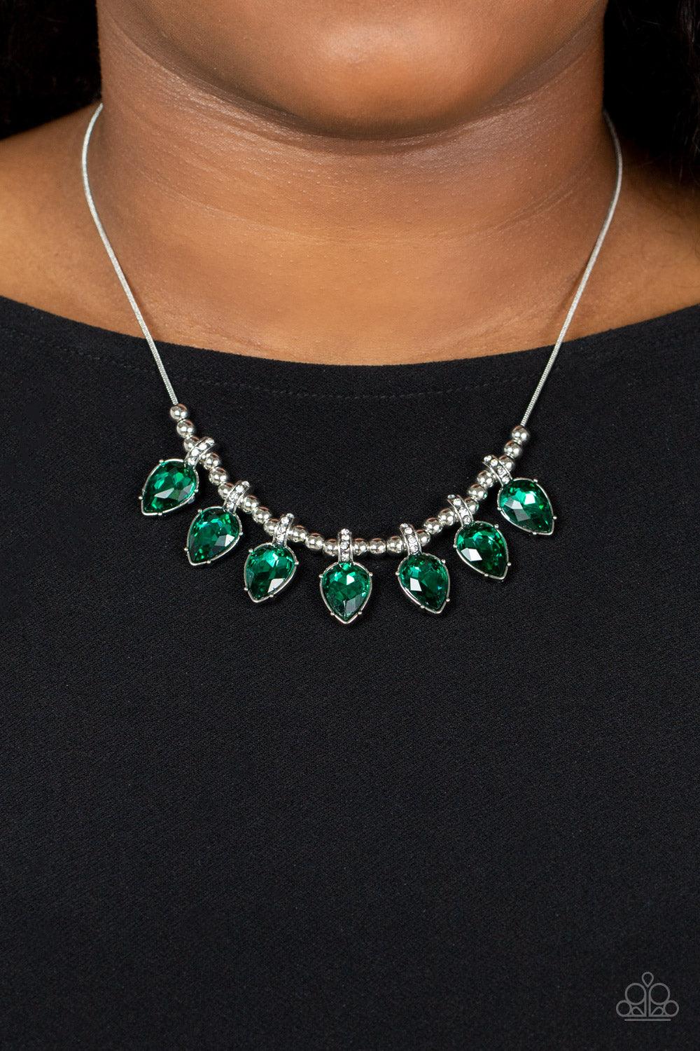 Paparazzi Accessories Crown Jewel Couture - Green Featuring glittery white rhinestone fittings, an oversized collection of glittery green teardrop gems are separated by trios of shiny silver beads along a round silver snake chain below the collar for a gl