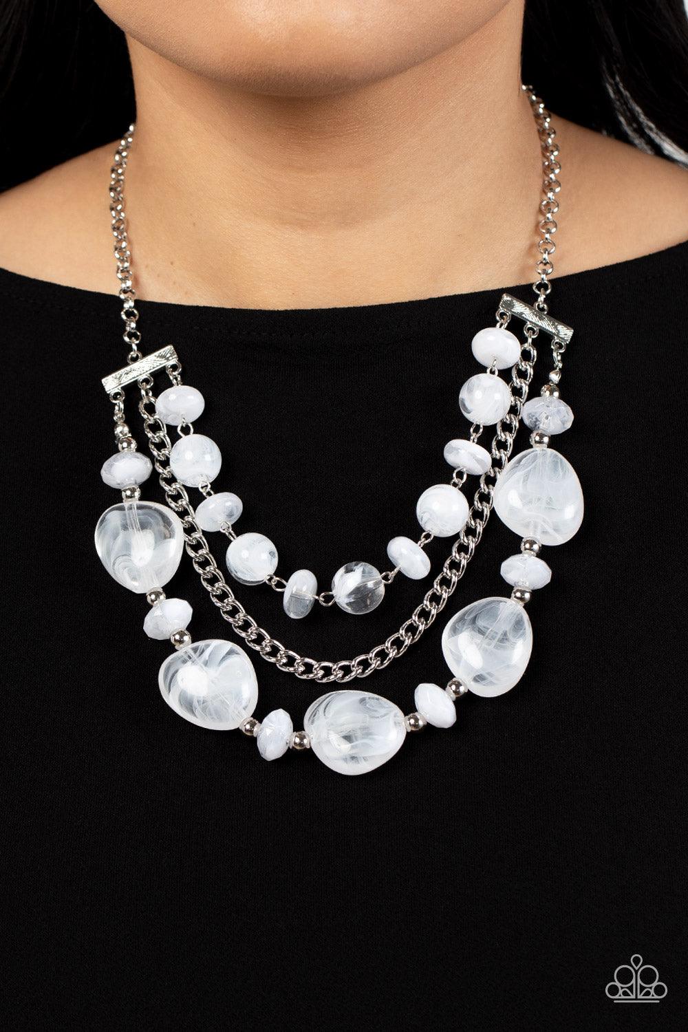 Paparazzi Accessories Oceanside Service - White A single silver chain separates two mismatched rows of oversized and cloudy glass-like white beads. The colorful rows are held in place with textured silver fittings, creating an ethereal pop of color below