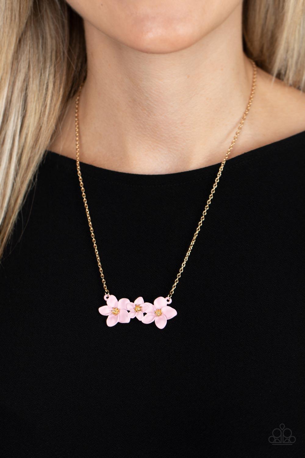 Paparazzi Accessories Petunia Picnic - Pink Featuring pronged gold centers, a trio of overlapping pink flowers in a flawless matte finish delicately connects to a dainty gold chain below the collar for a whimsical floral fashion. Features an adjustable cl