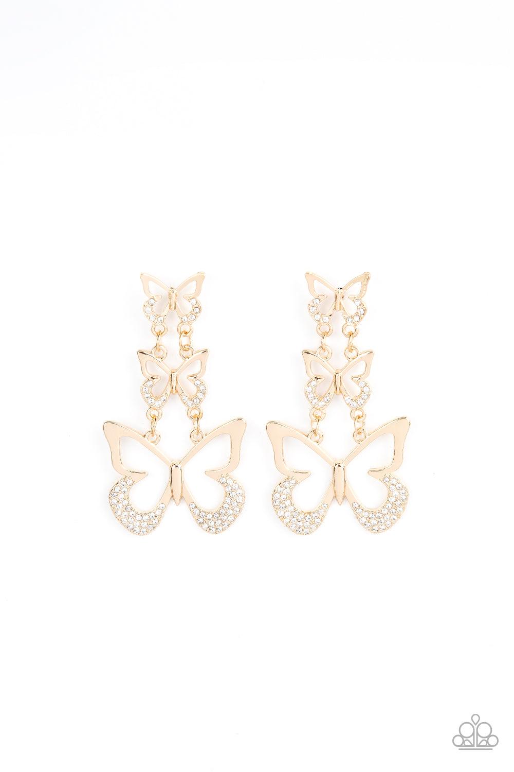 Paparazzi Accessories Flamboyant Flutter - Gold An airy trio of gold butterflies gradually increase in size as they link into a whimsical lure. The bottom of each butterfly has been dipped in white rhinestones, adding a glitzy finish to the fluttering cen