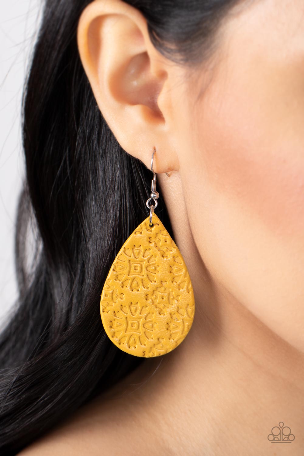 Paparazzi Accessories Stylishly Subtropical - Yellow Stamped in a geometric motif, a distressed yellow leather teardrop swings from the ear for a whimsically rustic flair. Earring attaches to a standard fishhook fitting. Sold as one pair of earrings. Jewe