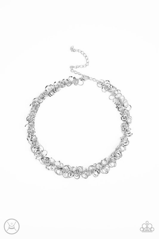 Paparazzi Accessories Cause a Commotion - Silver A shiny series of flat and beveled silver hoops delicately cluster along a dainty silver chain around the neck, creating a tinkling fringe. Features an adjustable clasp closure. Sold as one individual choke