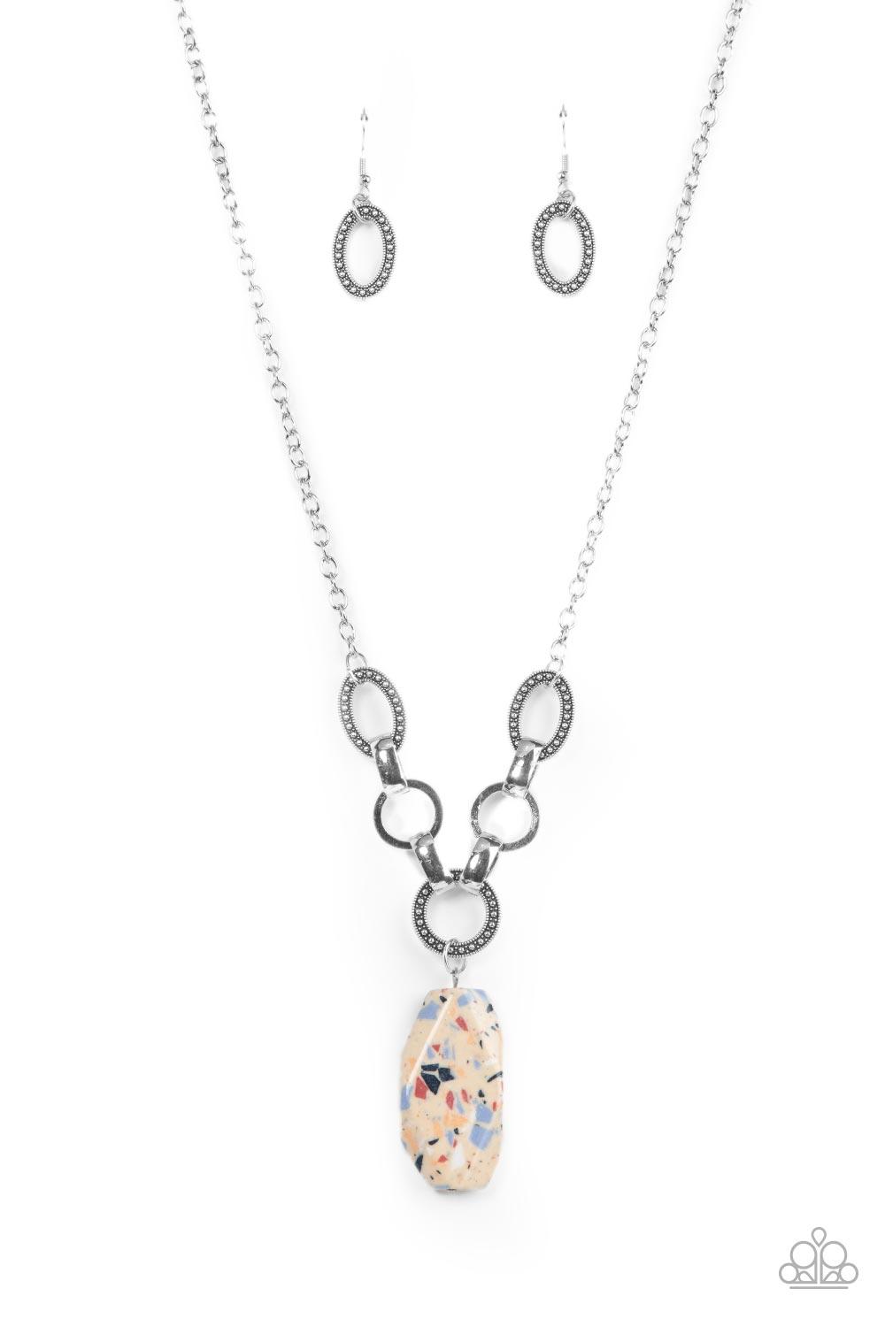Paparazzi Accessories Mystical Mineral - Multi Featuring a colorful multicolored terrazzo finish, a faceted faux stone swings from a row of studded silver rings, flat silver hoops, and oversized silver fittings, creating an earthy pendant below the collar
