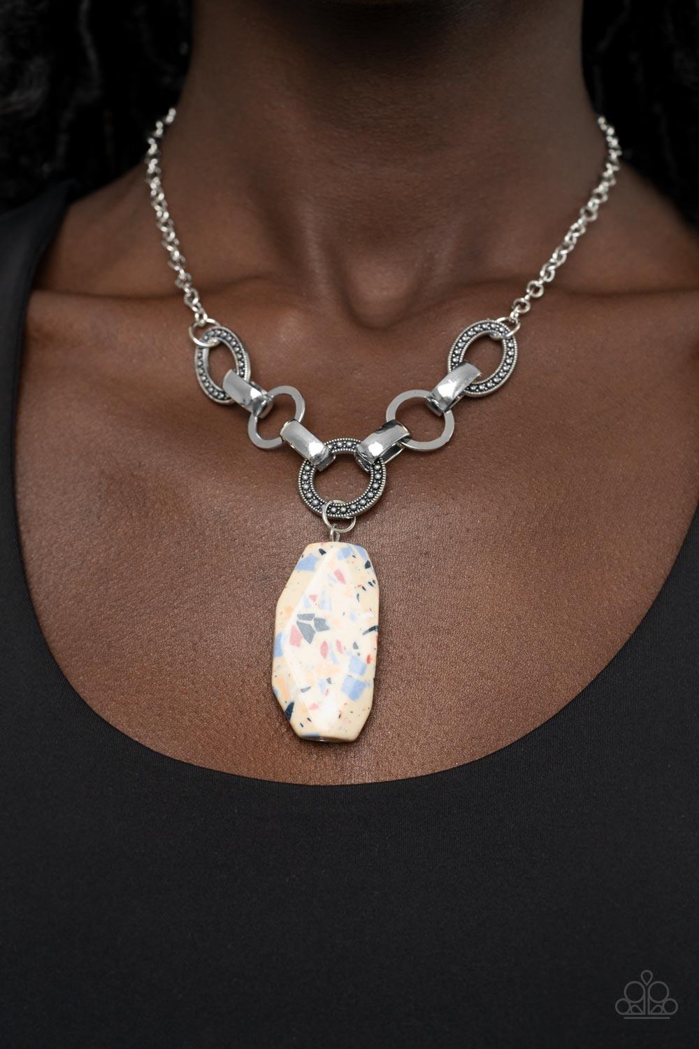 Paparazzi Accessories Mystical Mineral - Multi Featuring a colorful multicolored terrazzo finish, a faceted faux stone swings from a row of studded silver rings, flat silver hoops, and oversized silver fittings, creating an earthy pendant below the collar