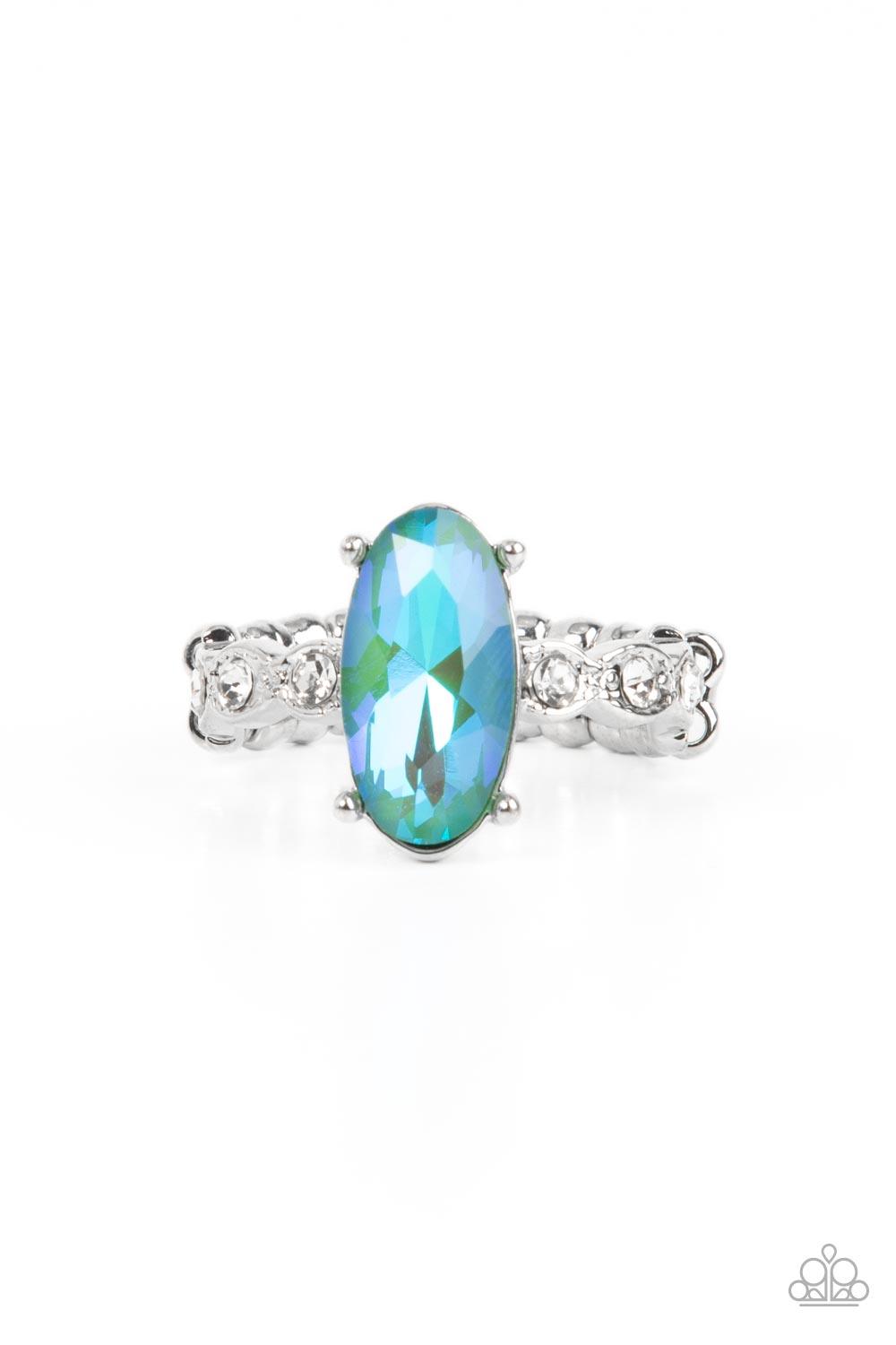 Paparazzi Accessories Stellar Sensation - Green Featuring a blue UV finish, an iridescent green oval rhinestone is nestled inside a pronged silver frame atop a dainty band of white rhinestones for a stellar fashion. Features a dainty stretchy band for a f