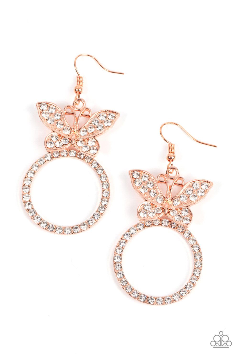 Paparazzi Accessories Paradise Found - Copper A white rhinestone encrusted shiny copper butterfly flutters atop a shiny copper ring dotted in matching white rhinestones, resulting in a dazzling statement piece. Earring attaches to a standard fishhook fitt