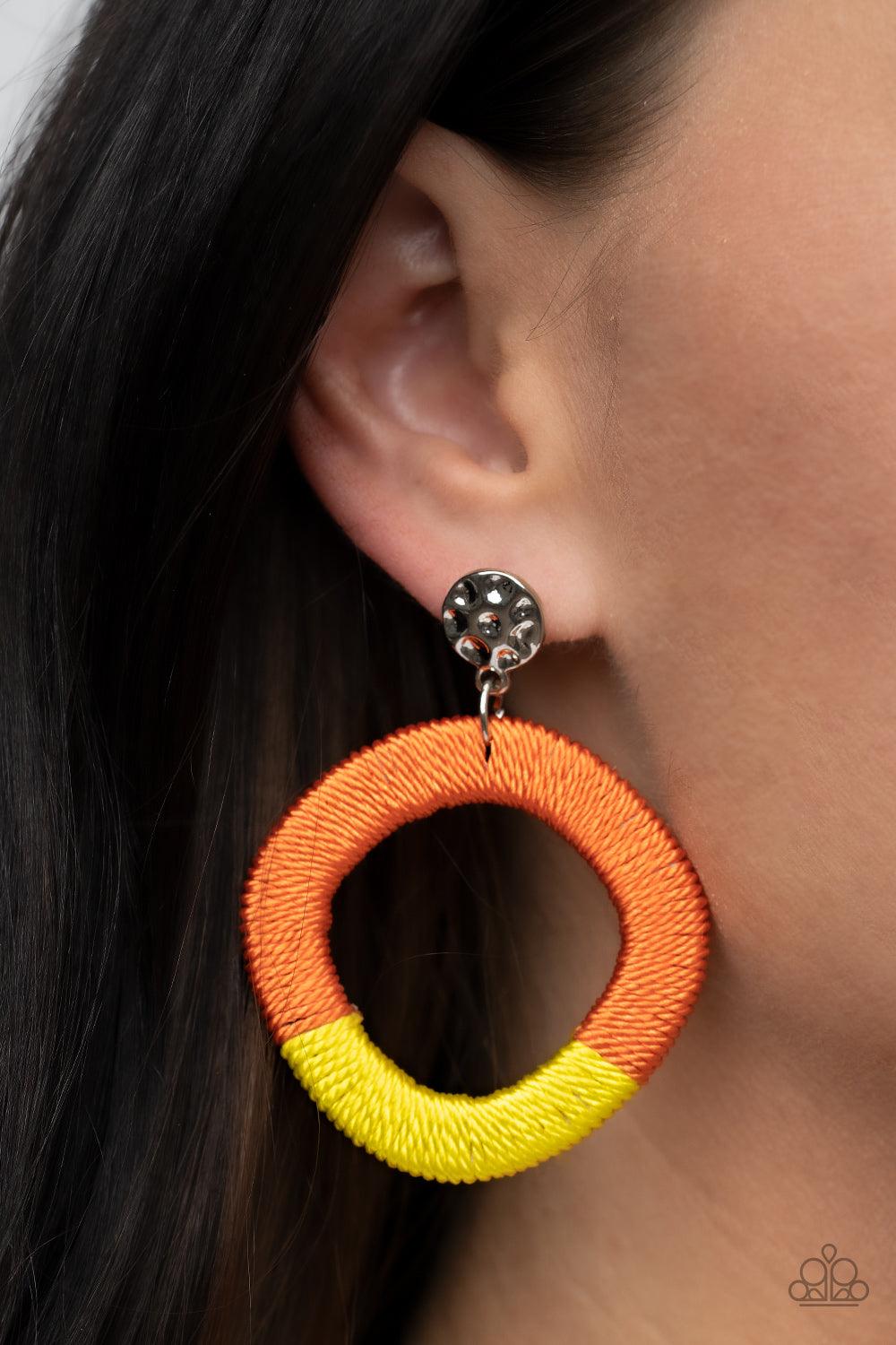 Paparazzi Accessories Thats a WRAPAROUND - Multi A hammered silver disc gives way to a wooden frame decoratively wrapped in shiny orange and yellow threaded accents, creating a colorful lure. Earring attaches to a standard post fitting. Sold as one pair o
