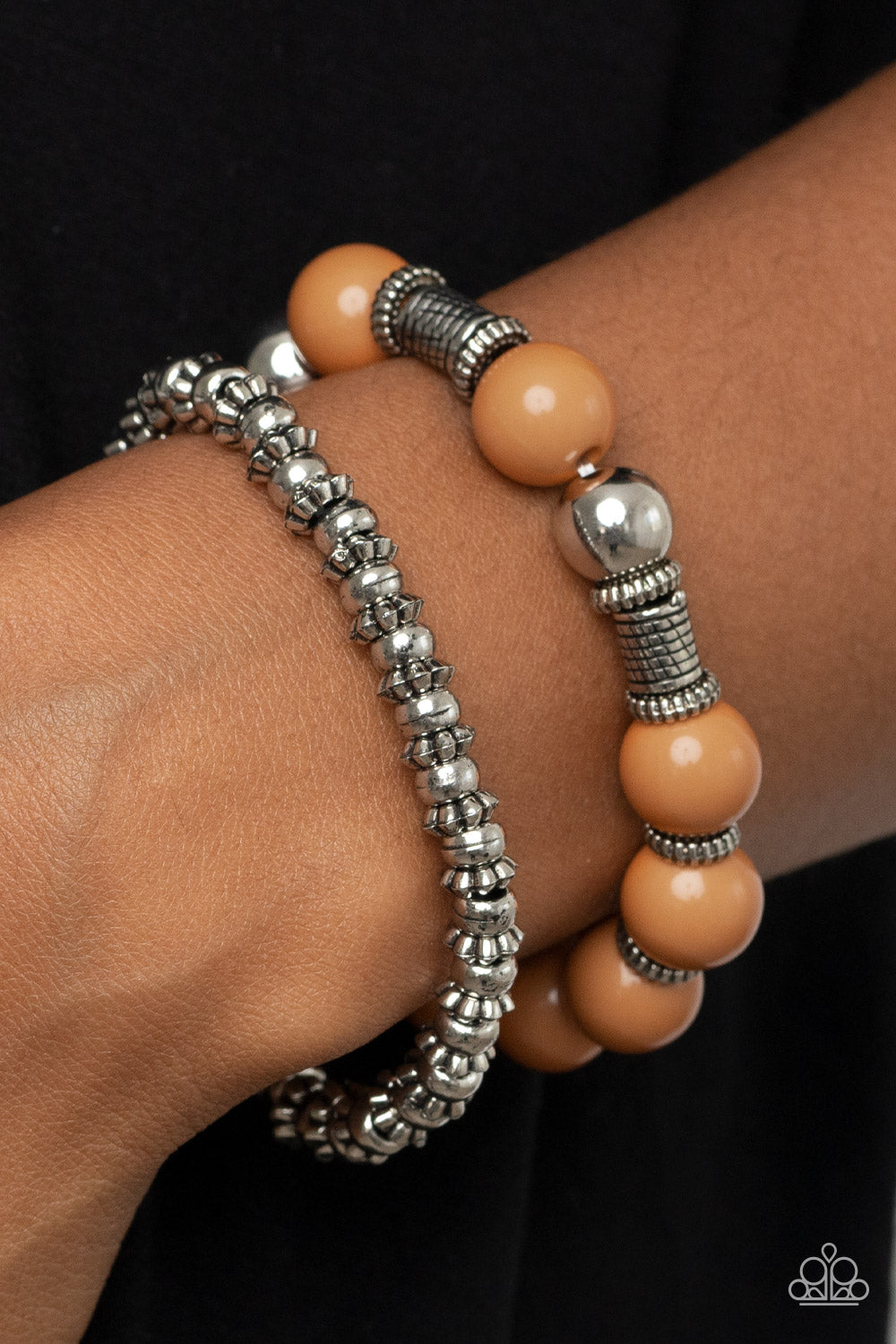 Paparazzi Accessories Walk This SWAY - Brown Infused with a dainty strand of ornate silver accents, an oversized collection of brown beads, silver beads, and textured silver accents are threaded along stretchy bands around the wrist for a hearty pop of co