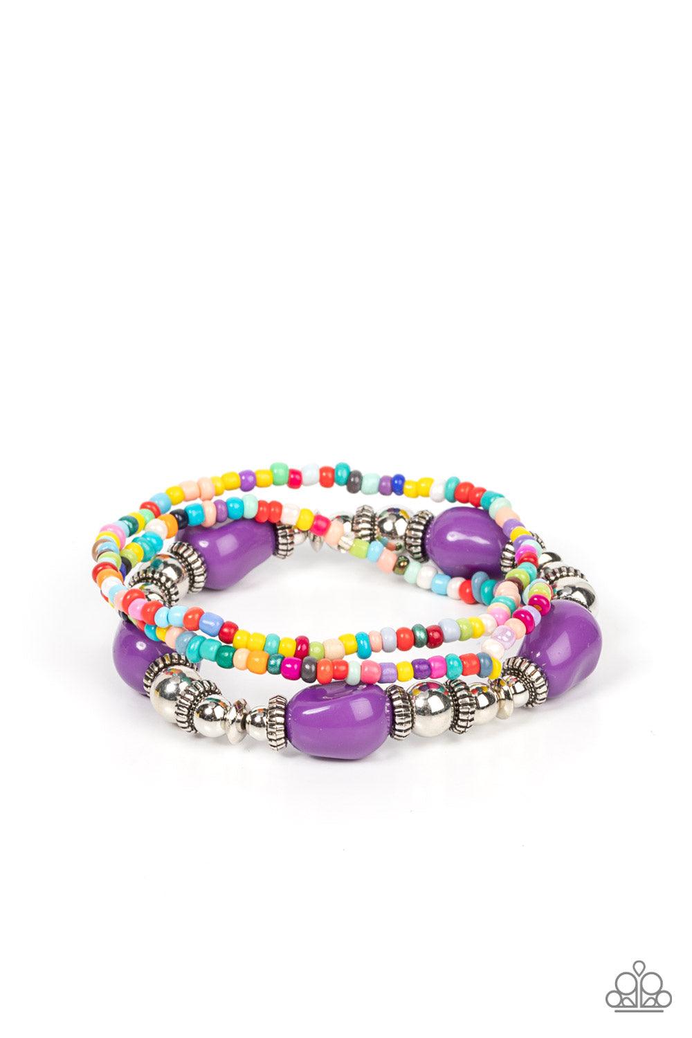 Paparazzi Accessories Confidently Crafty - Purple A pair of multicolored seed beaded stretchy bracelets joins a stretchy strand of shiny silver beads, textured silver accents, and faceted purple beads around the wrist, creating colorful layers. Sold as on