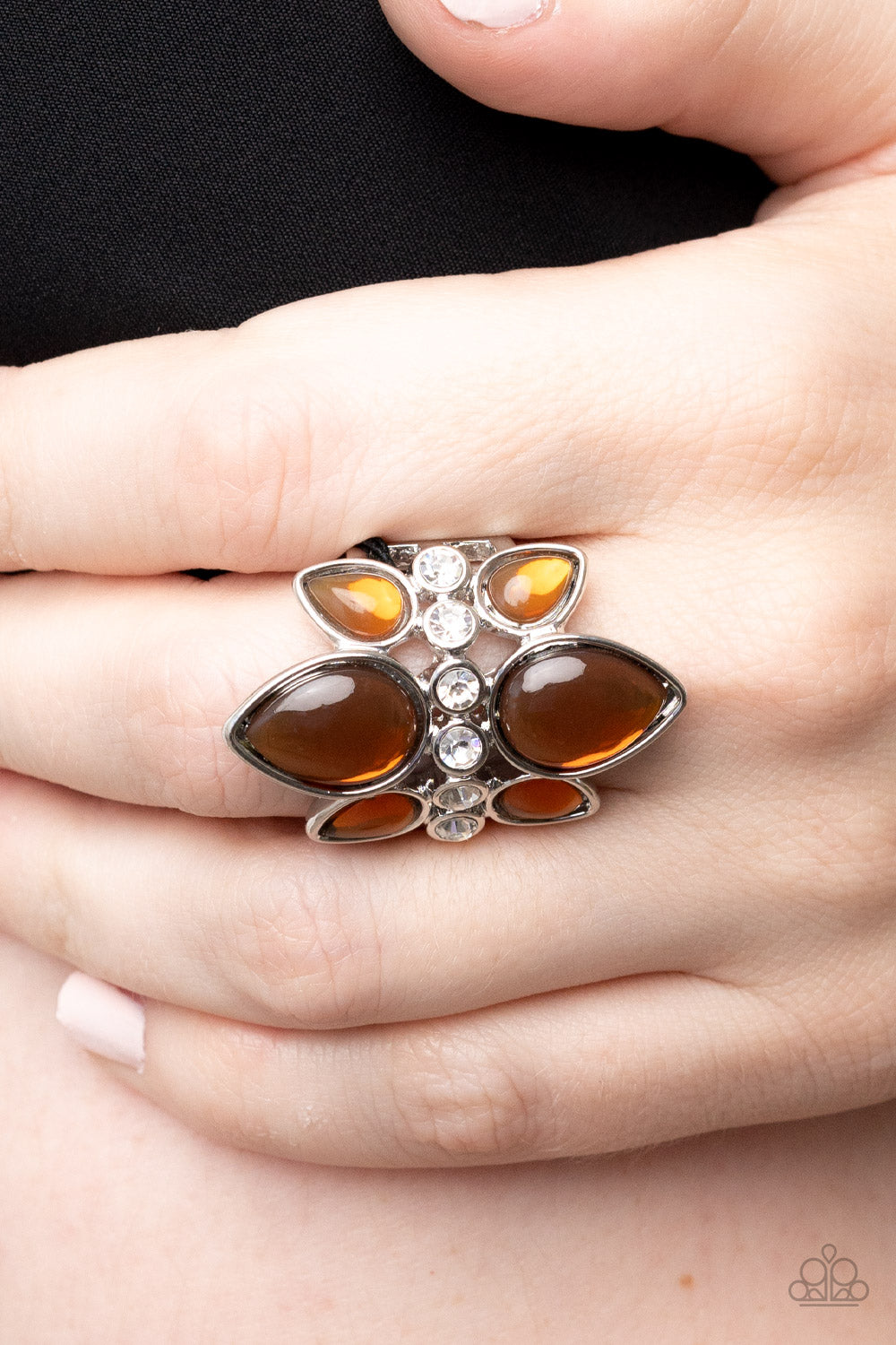 Paparazzi Accessories TRIO Tinto - Brown Crowns of glassy brown teardrop beads fan out from a center of glassy white rhinestones, coalescing into an ethereal centerpiece atop the finger. Features a stretchy band for a flexible fit. Sold as one individual