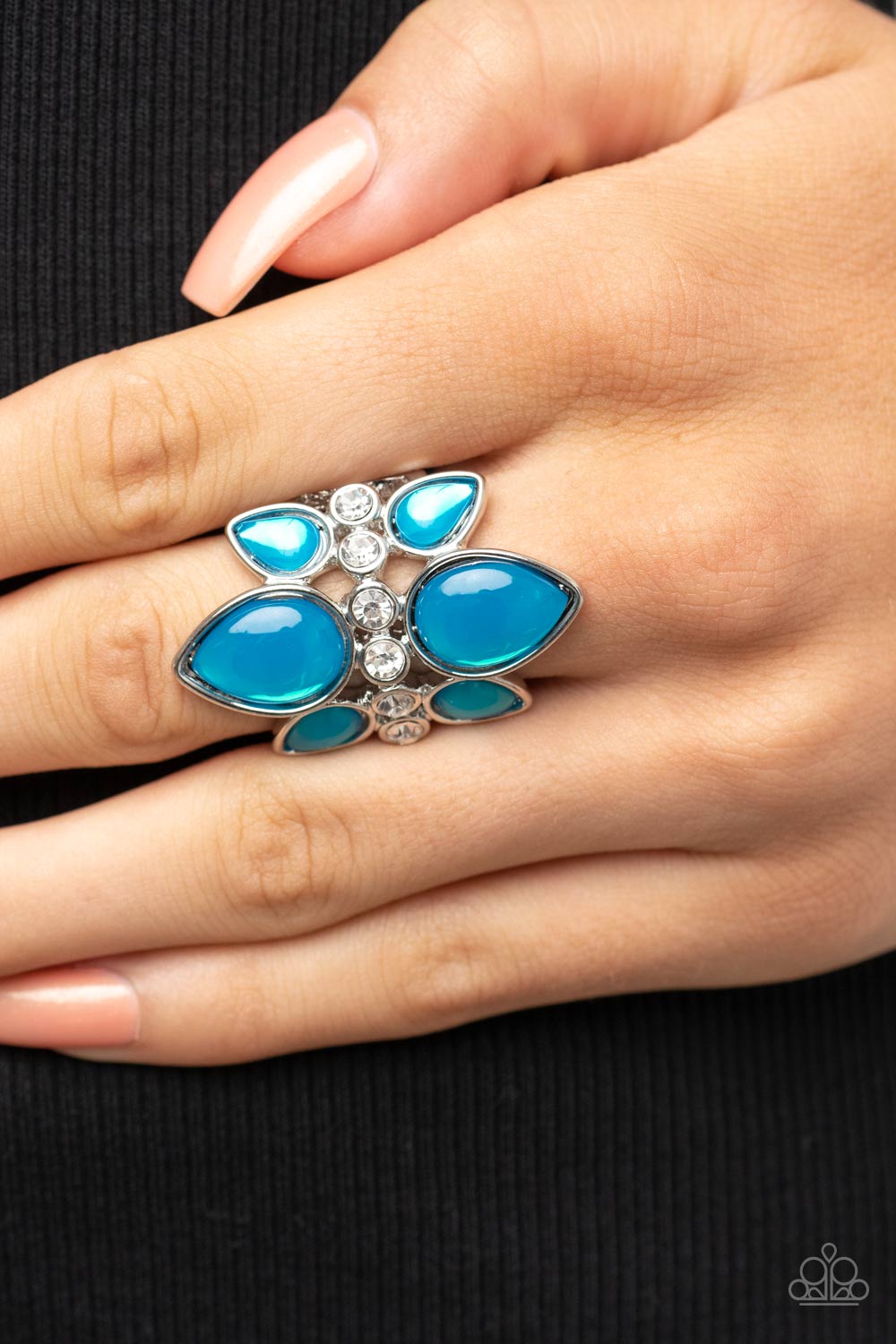 Paparazzi Accessories TRIO Tinto - Blue Crowns of glassy blue teardrop beads fan out from a center of glassy white rhinestones, coalescing into an ethereal centerpiece atop the finger. Features a stretchy band for a flexible fit. Sold as one individual ri