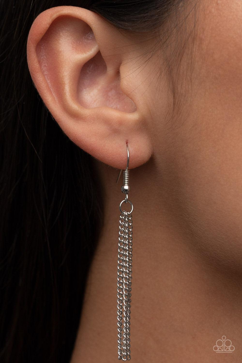 Paparazzi Accessories Follow the LUSTER - Multi Glassy white, oil spill, and hematite triangular gems gradually increase in size as they swing from the bottoms of extended silver chains, layering into an edgy shimmer across the chest. Features an adjustab