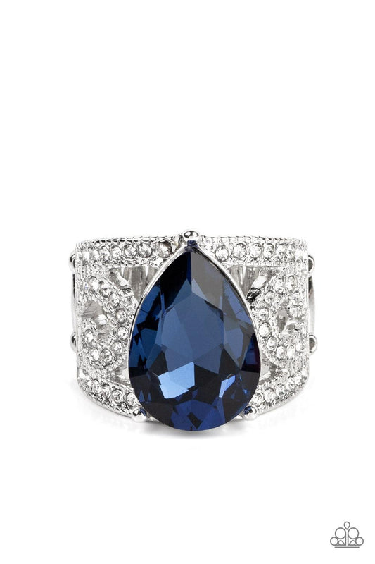 Paparazzi Accessories Kinda a Big Deal - Blue An oversized teardrop gem in the Pantone® of Polar Night embellishes the center of a regal, filigree-filled band dotted in glassy white rhinestones, invoking a royal radiance atop the finger. Features a stretc